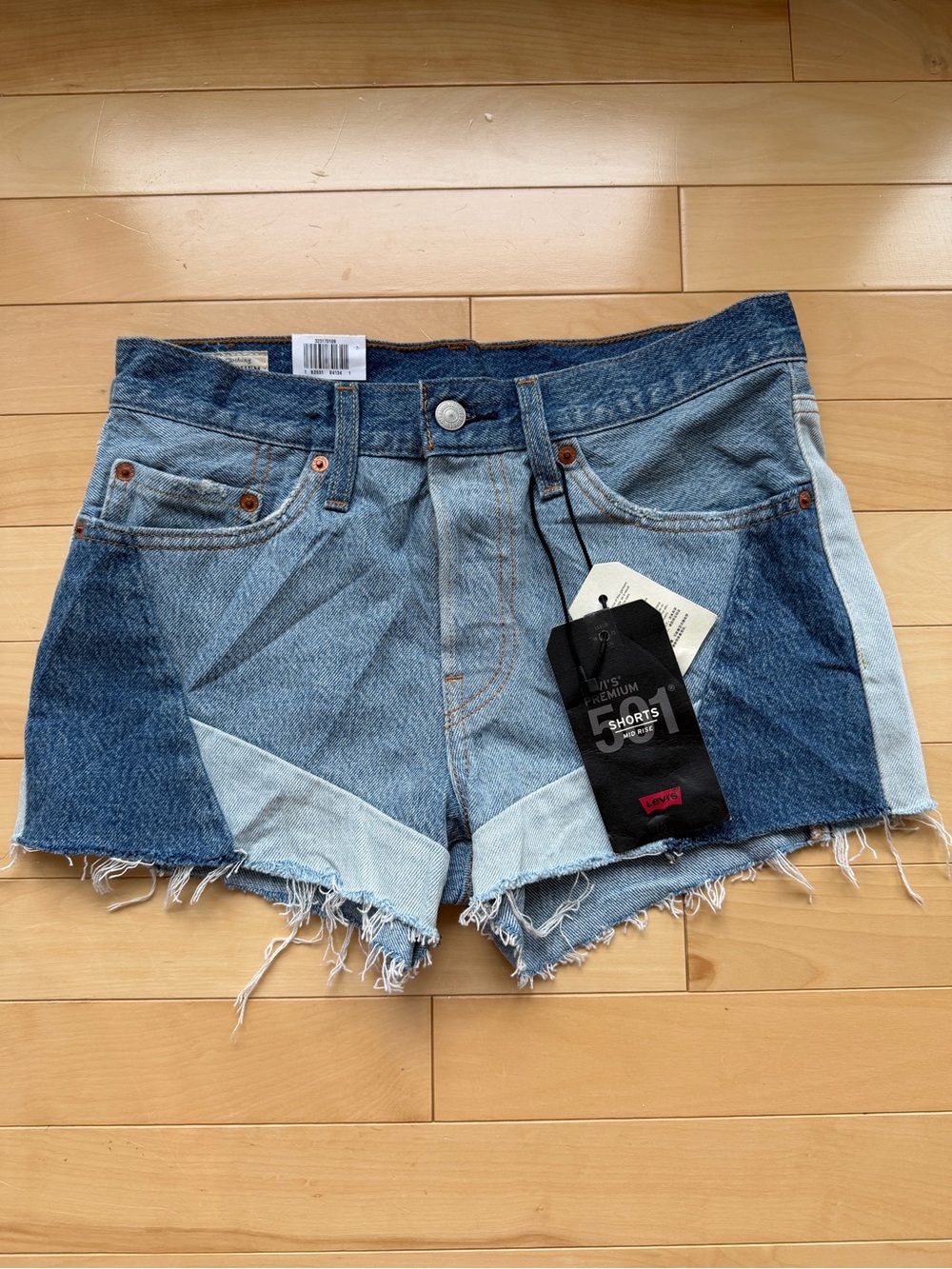 Levi's Premium 501 color block denim shorts featuring two-tone patchwork sz 26